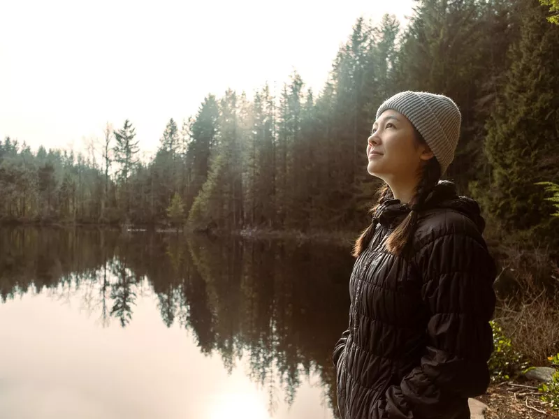 Multi-Ethnic Young Woman at Edge of Lake British Columbia