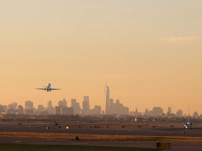 Airplane Take Off with New York City Skyline