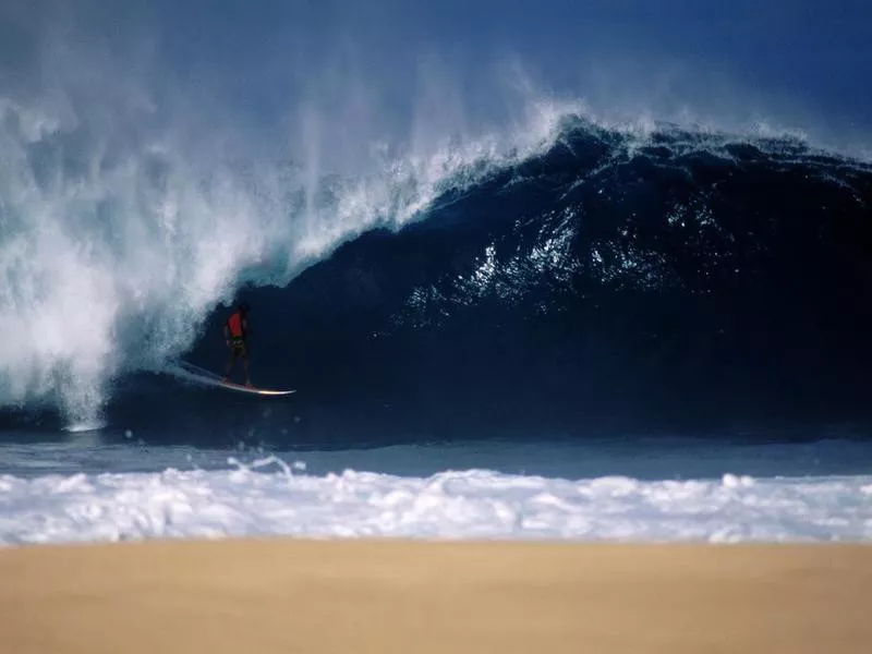 Surfer at big Pipeline, Oahu