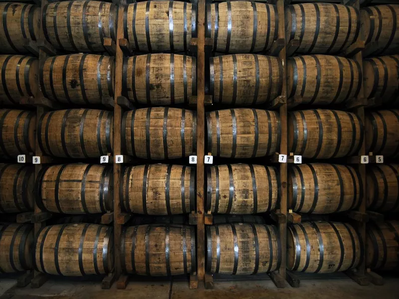 Stack of wooden whiskey barrels