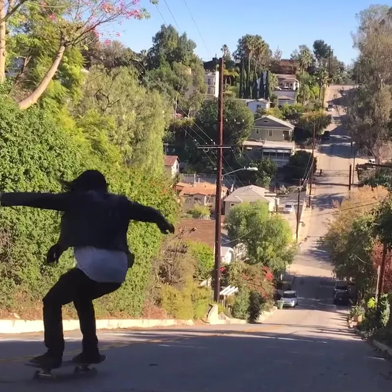 Skateboarding down Baxter Street