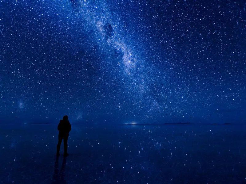 Milky way reflected on the water at Uyuni