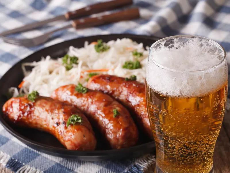 Lager beer and snacks of sausages and sauerkraut