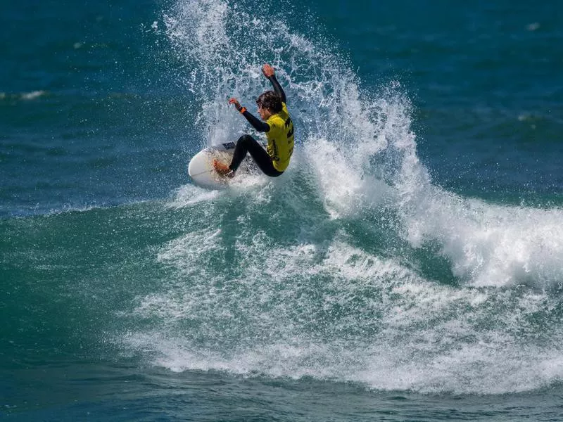 Surfer in Ribeira de Ilhas Beach in Ericeira Portugal.