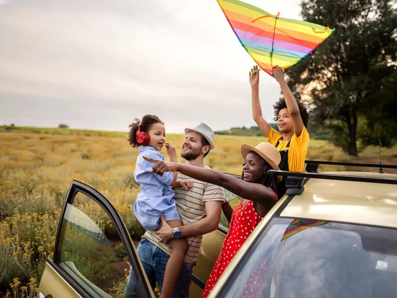 Happy multi-ethnic family with children ready for vacation