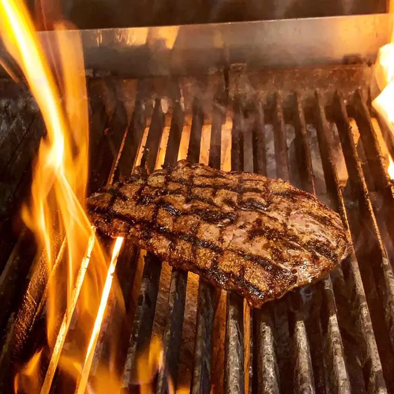 Rib eye grilling at St. Elmo Steak House