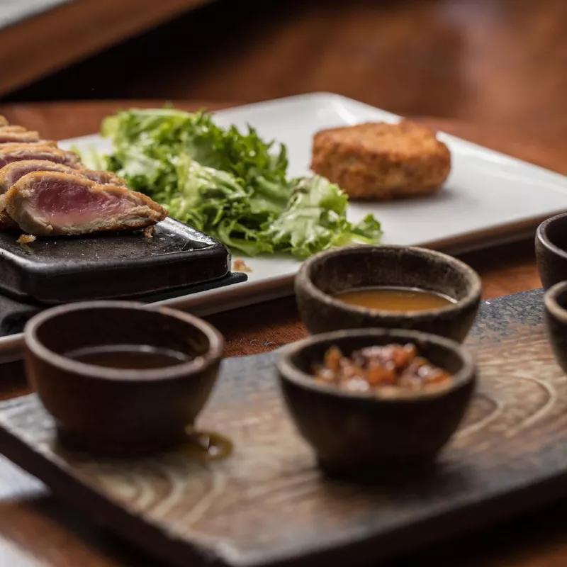 Steak with sauces at Nick and Sam’s Steakhouse