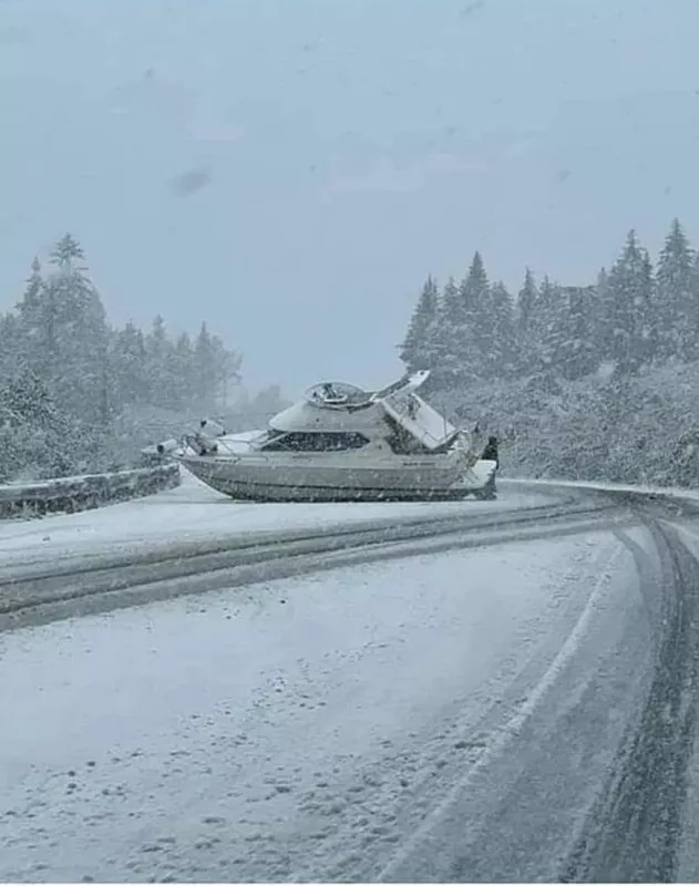 Boat in the road covered in snow