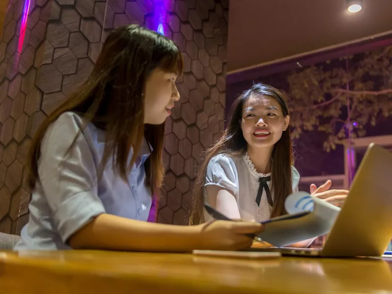 Two women working in Vietnam