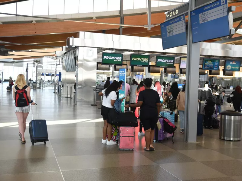 People checking in at the Raleigh airport