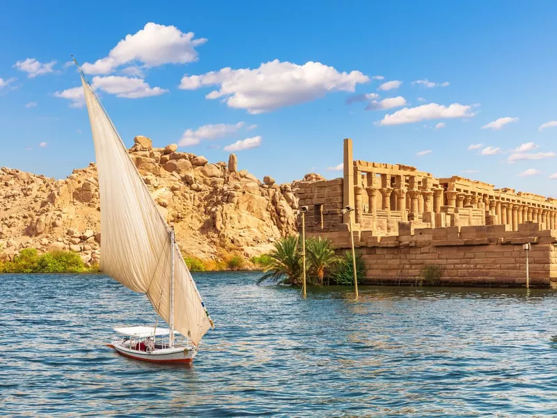 Felucca by the Temple of Philae on the Agilikia island, the Nile, Aswan, Egypt