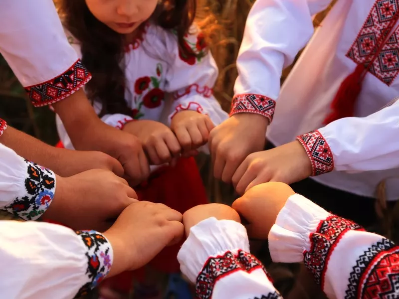 Children wearing traditional Ukraine shirts