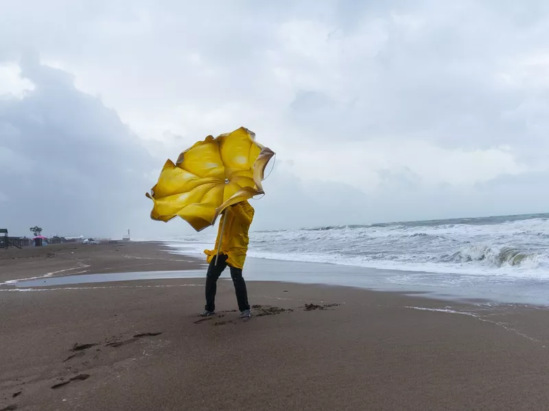 Man on stormy beach turkey