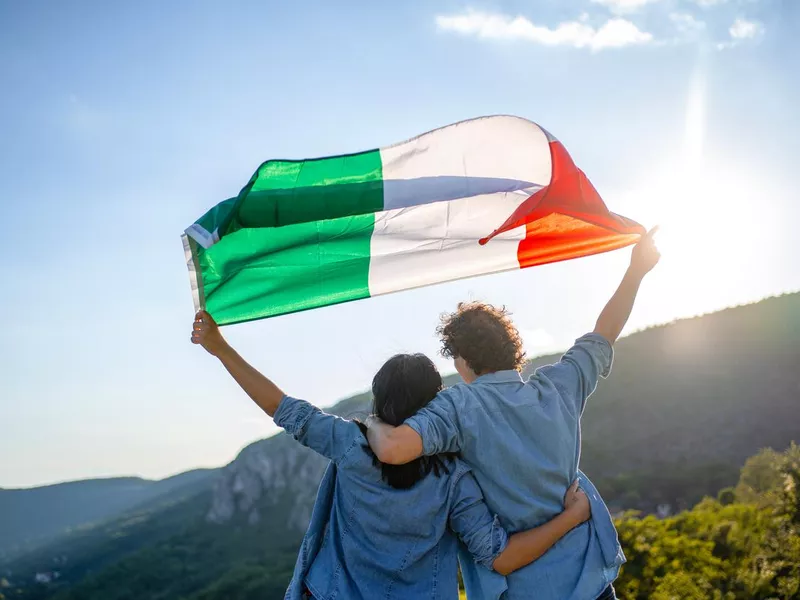 couple holding Italian national flag