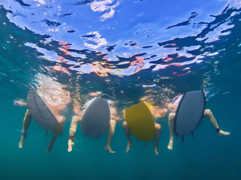 Friends surfing in Maui