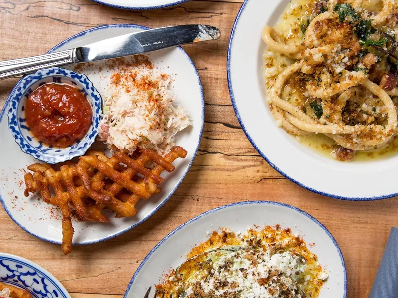 Plates of food at Giant, a restaurant in Chicago