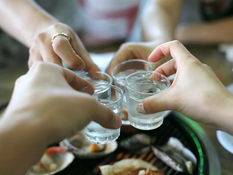 Group of friends drinking soju