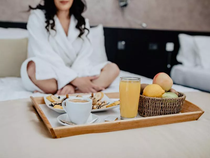 Breakfast in bed in hotel room