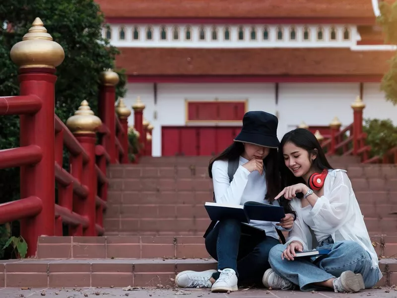 Two Young students campus learning easy language for english speakers