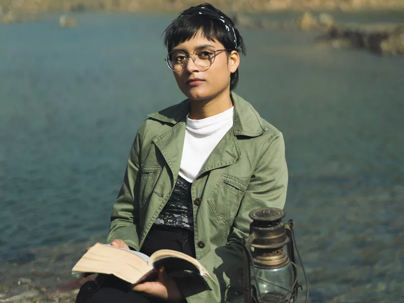 Young women reading on vacation