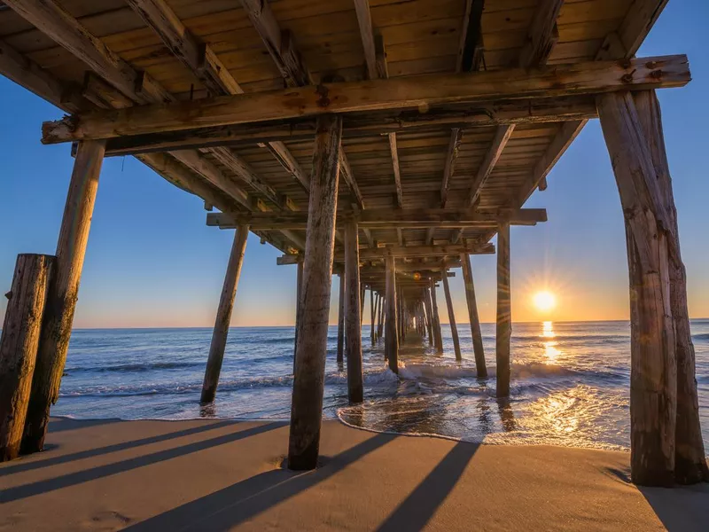 Underneath Nags Head Pier at sunrise