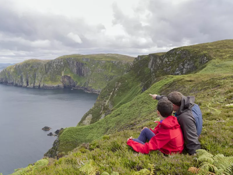 Father and son admiring landscape