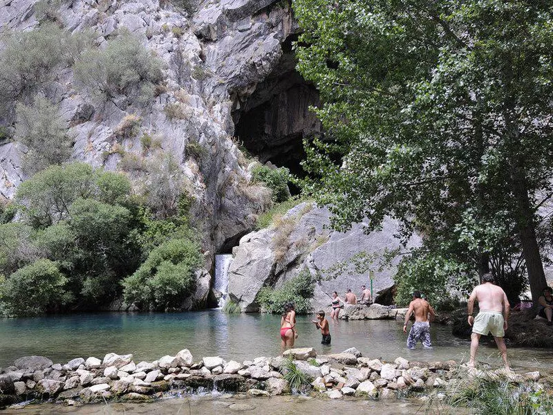 People bathing in Spain's Cueva del Gato