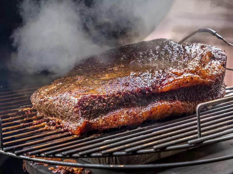 Fresh smoked Texas bbq brisket on the grill